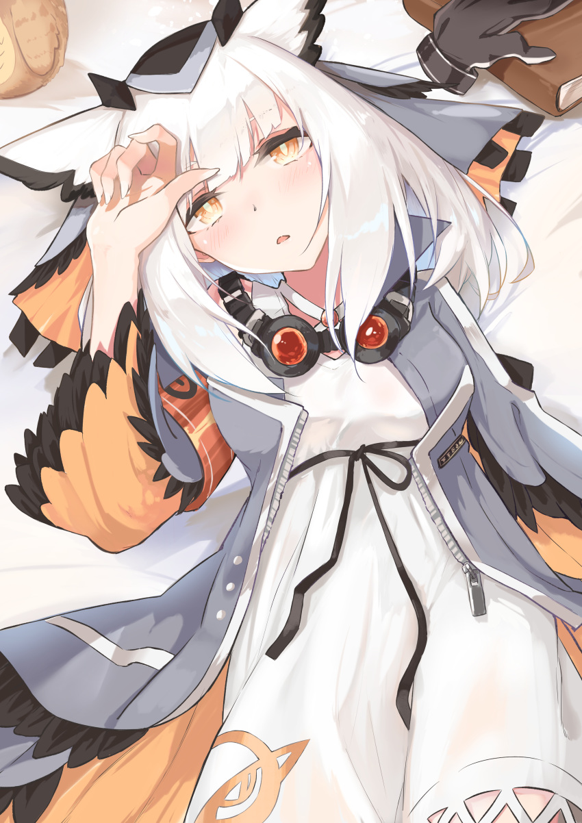1girl absurdres arknights armband bangs bed blush book coat commentary fingernails gloves goggles goggles_around_neck grey_coat highres kashiyarrm long_hair long_sleeves looking_at_viewer lying on_back open_mouth orange_eyes owl_ears ptilopsis_(arknights) rhine_lab_logo single_glove solo white_hair