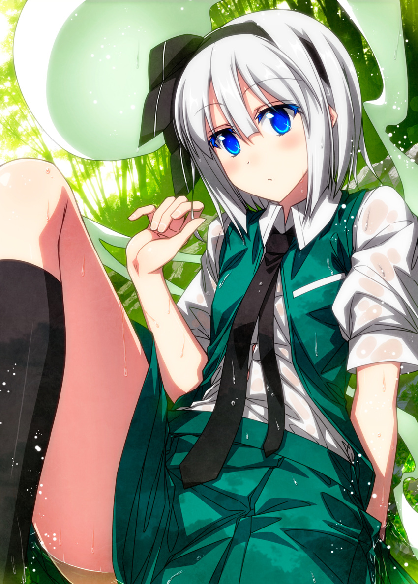 1girl black_bow black_hairband black_legwear black_neckwear blue_eyes blush bow closed_mouth collared_shirt colored_eyelashes commentary_request dutch_angle eyebrows_visible_through_hair feet_out_of_frame green_skirt green_vest hair_between_eyes hair_bow hairband hand_up highres hitodama kneehighs konpaku_youmu konpaku_youmu_(ghost) looking_at_viewer lying miniskirt necktie on_back on_ground open_clothes open_vest outdoors sazanami_mio shirt short_hair short_sleeves silver_hair skirt solo touhou vest water white_shirt wing_collar