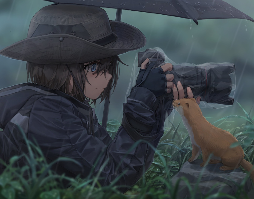 1girl bangs black_hair black_headwear black_jacket blue_eyes blush camera closed_mouth grass hat highres holding holding_camera jacket long_sleeves lying on_stomach original rain short_hair smile umbrella weasel yohan1754