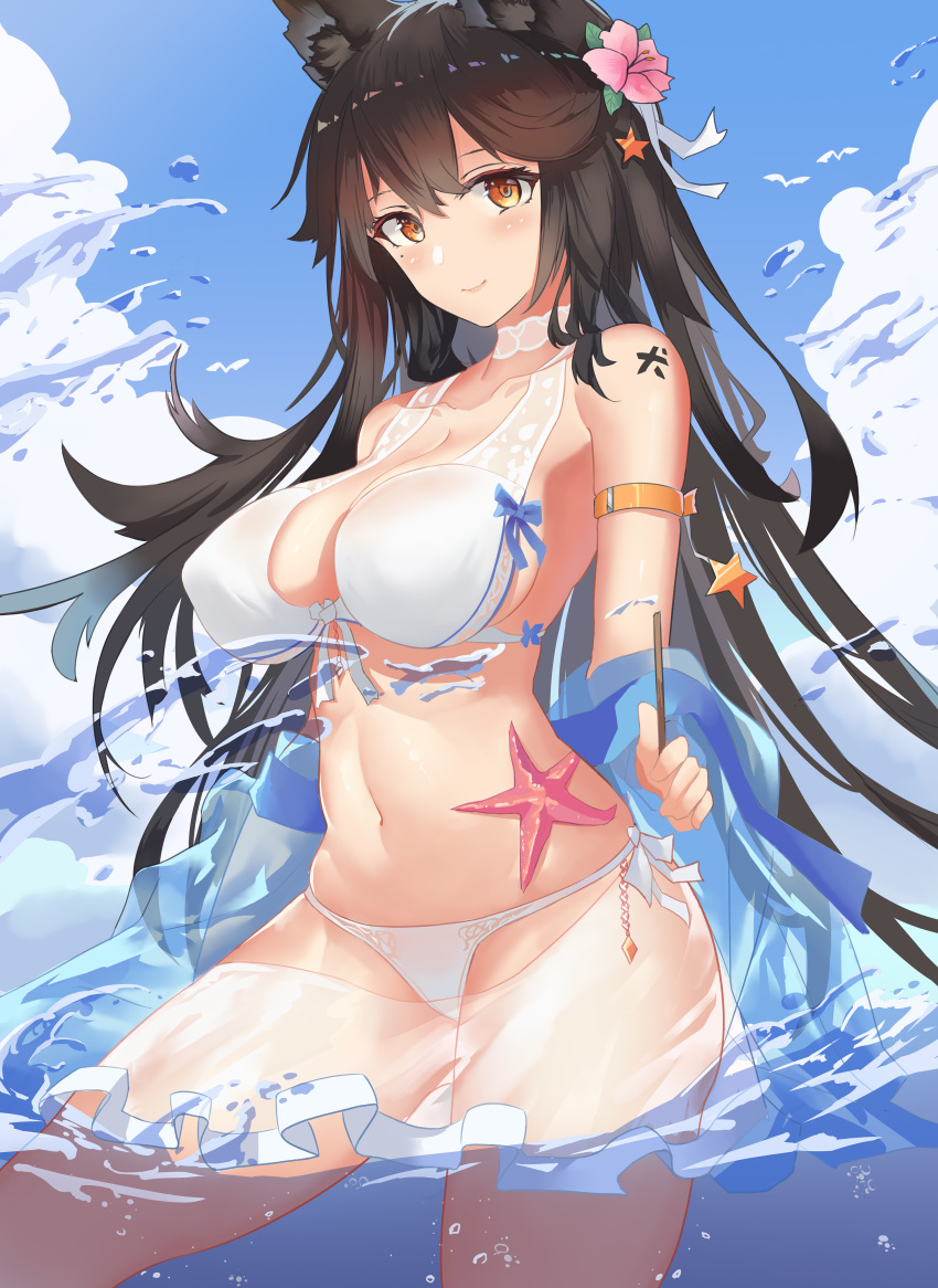 1girl absurdres animal_ears armband atago_(azur_lane) atago_(midsummer_march)_(azur_lane) azur_lane bikini black_hair blue_sky breasts brown_eyes chinese_commentary clouds commentary_request cowboy_shot day extra_ears flower hair_flower hair_ornament highres large_breasts long_hair looking_at_viewer mole mole_under_eye outdoors sky solo starfish swimsuit water white_bikini wjn-rance