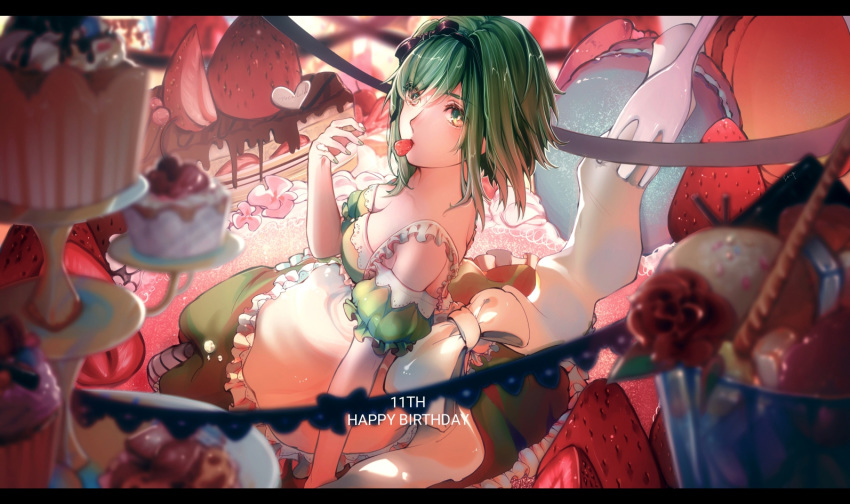 1girl apron birthday blurry_foreground bow cake chocolate commentary cupcake dessert dress food food_in_mouth fork frilled_apron frills from_side fruit green_dress green_eyes green_hair green_sleeves gumi hair_bow happy_birthday ice_cream looking_at_viewer mouth_hold oversized_food oversized_object sitting solo stepcacc strapless strapless_dress strawberry sweets tiered_tray vocaloid wafer_stick
