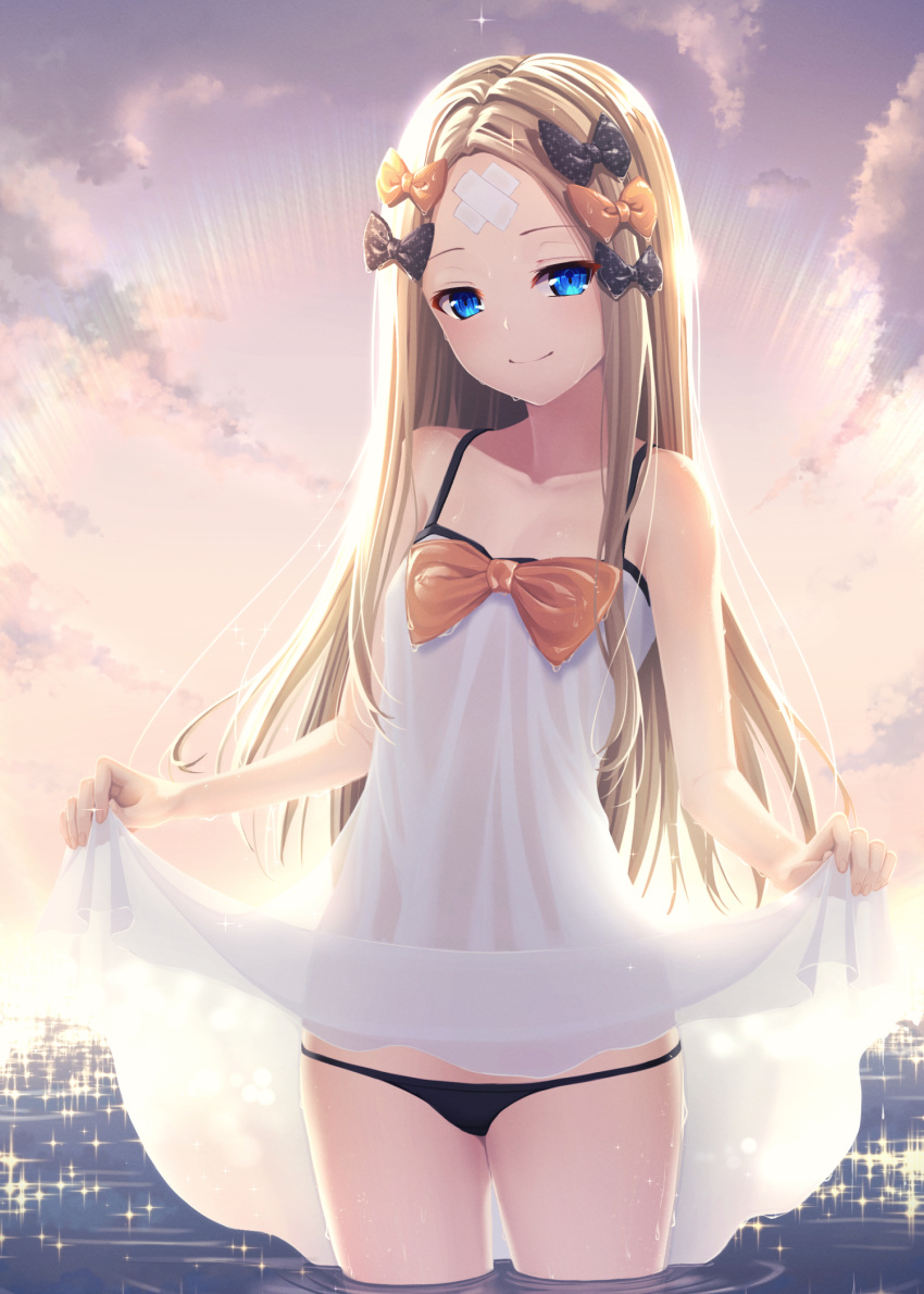 1girl abigail_williams_(fate/grand_order) backlighting bandaid bandaid_on_forehead bangs bare_shoulders black_bow black_panties blonde_hair blue_eyes bow breasts closed_mouth collarbone crossed_bandaids dress dress_lift fate/grand_order fate_(series) forehead gradient_sky hair_bow highres kaffeinman long_hair multiple_bows ocean orange_bow orange_sky panties parted_bangs polka_dot polka_dot_bow revision sky small_breasts smile sparkle sunset thighs twilight underwear wet white_dress