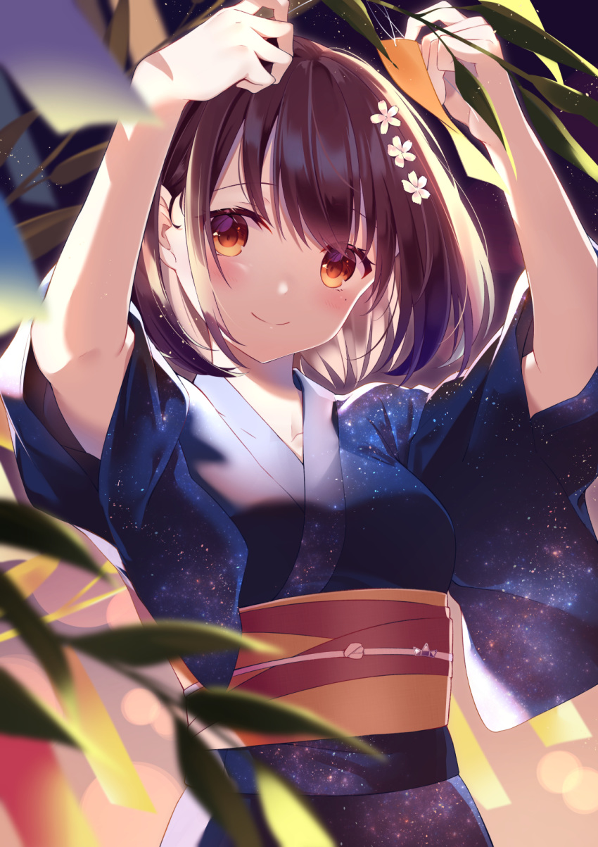 1girl bangs blue_kimono blurry blurry_foreground blush brown_eyes brown_hair closed_mouth commentary_request depth_of_field eyes_visible_through_hair flower hair_flower hair_ornament highres japanese_clothes kimono kisaragi_yuri mole mole_under_eye night obi original outdoors print_kimono sash short_sleeves smile solo starry_sky_print tanabata tanzaku upper_body white_flower wide_sleeves yukata