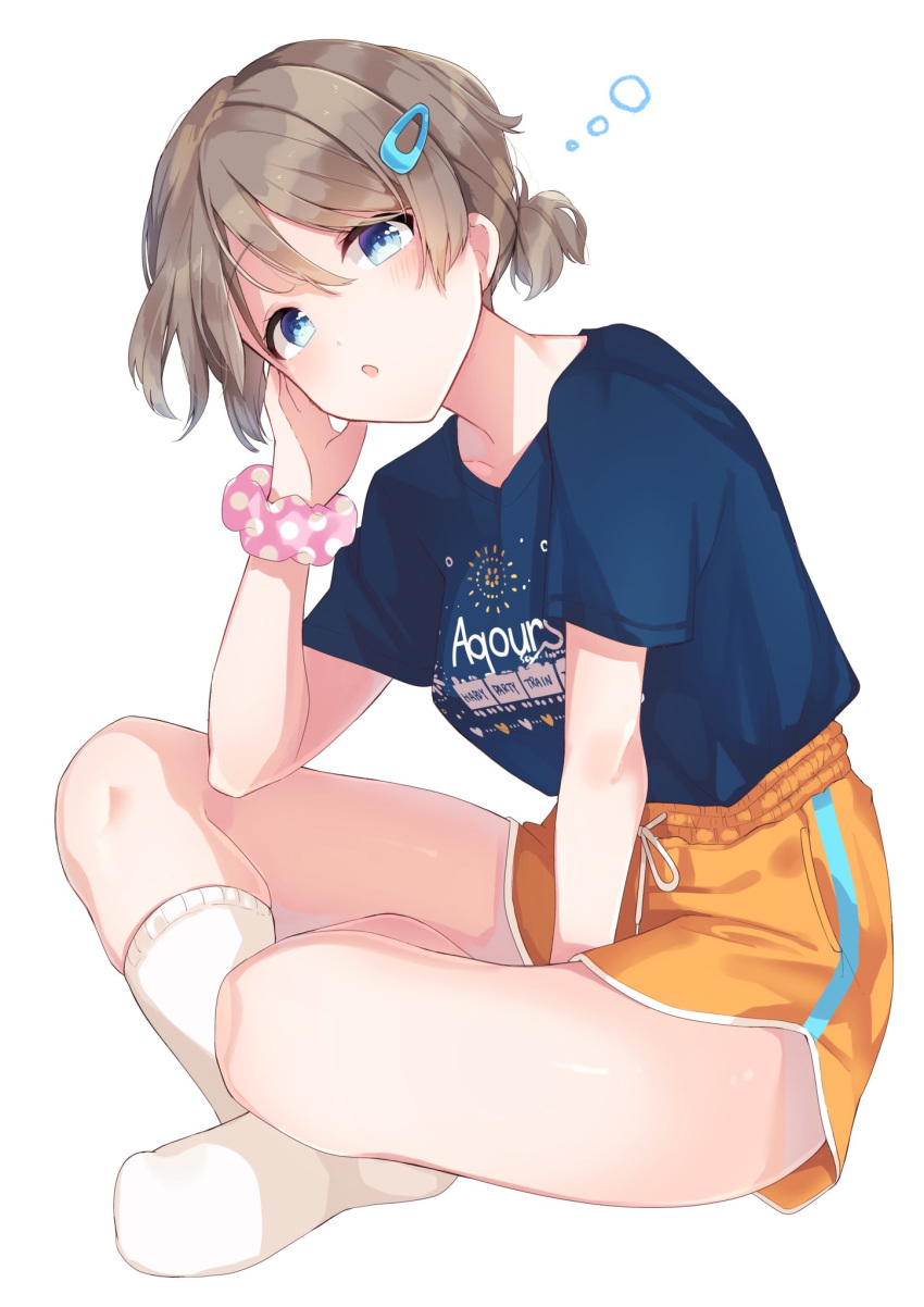 1girl blue_eyes blue_shirt brown_hair goroo_(eneosu) hair_between_eyes highres indian_style looking_at_viewer love_live! love_live!_sunshine!! polka_dot polka_dot_scrunchie scrunchie shirt short_hair shorts simple_background sitting socks solo watanabe_you white_background white_legwear wrist_scrunchie yellow_shorts