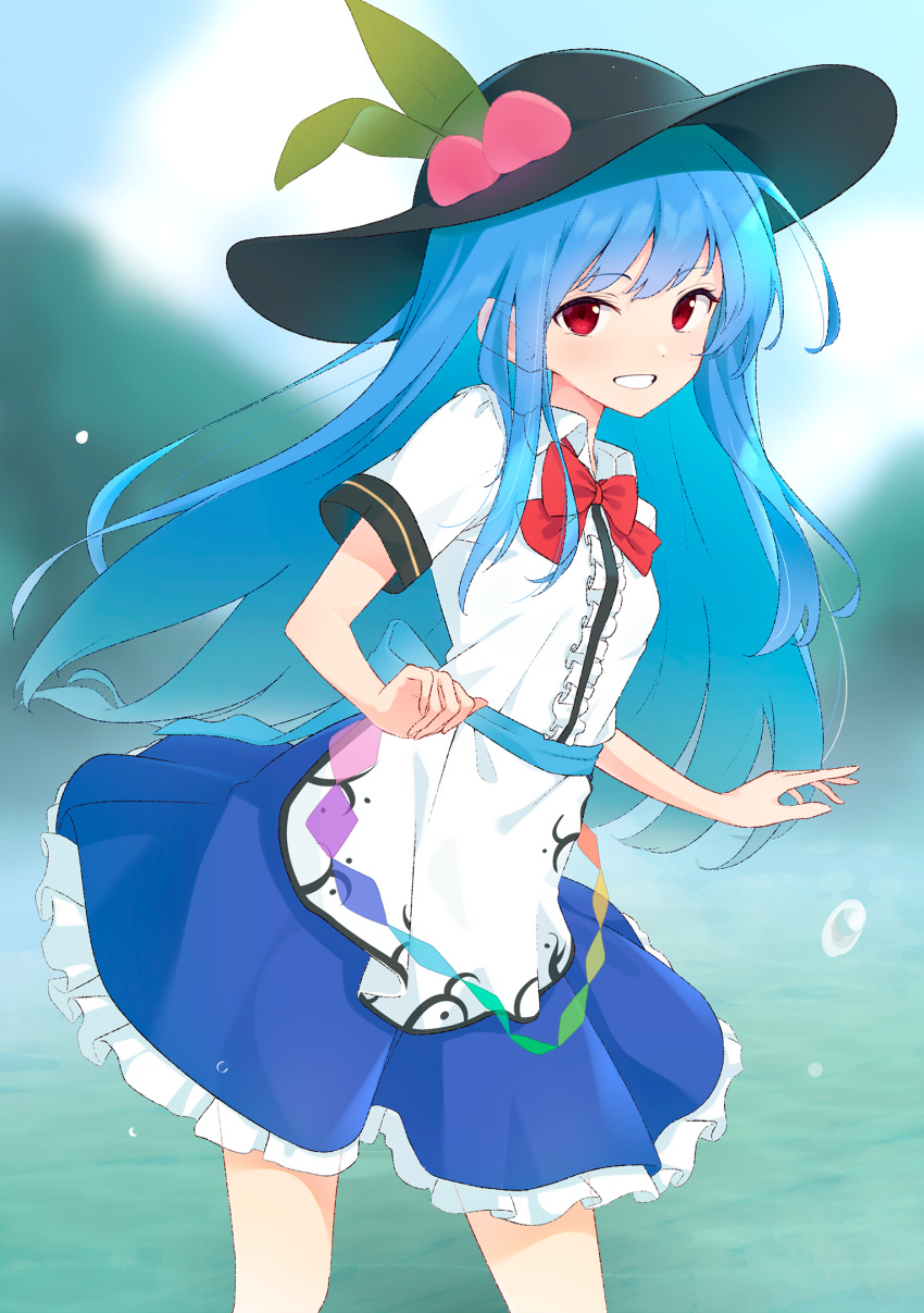 1girl arms_up black_headwear blue_hair blue_skirt blurry blurry_background bow bowtie cropped_legs day dress eyebrows_visible_through_hair grin hat highres hinanawi_tenshi kanpa_(campagne_9) layered_dress long_hair looking_at_viewer mountain outdoors petticoat red_eyes red_neckwear sash shirt short_sleeves skirt smile solo standing touhou very_long_hair water water_drop white_shirt