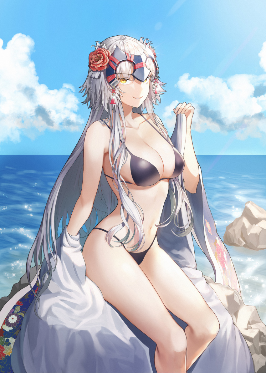 1girl absurdres bangs beach bikini black_bikini breasts day fate/grand_order fate_(series) flower grin hair_flower hair_ornament headpiece highres jeanne_d'arc_(alter)_(fate) jeanne_d'arc_(fate)_(all) large_breasts long_hair looking_at_viewer navel off_shoulder outdoors parted_lips sidelocks silver_hair sitting smile solo ssuel stomach swimsuit thighs tsurime yellow_eyes