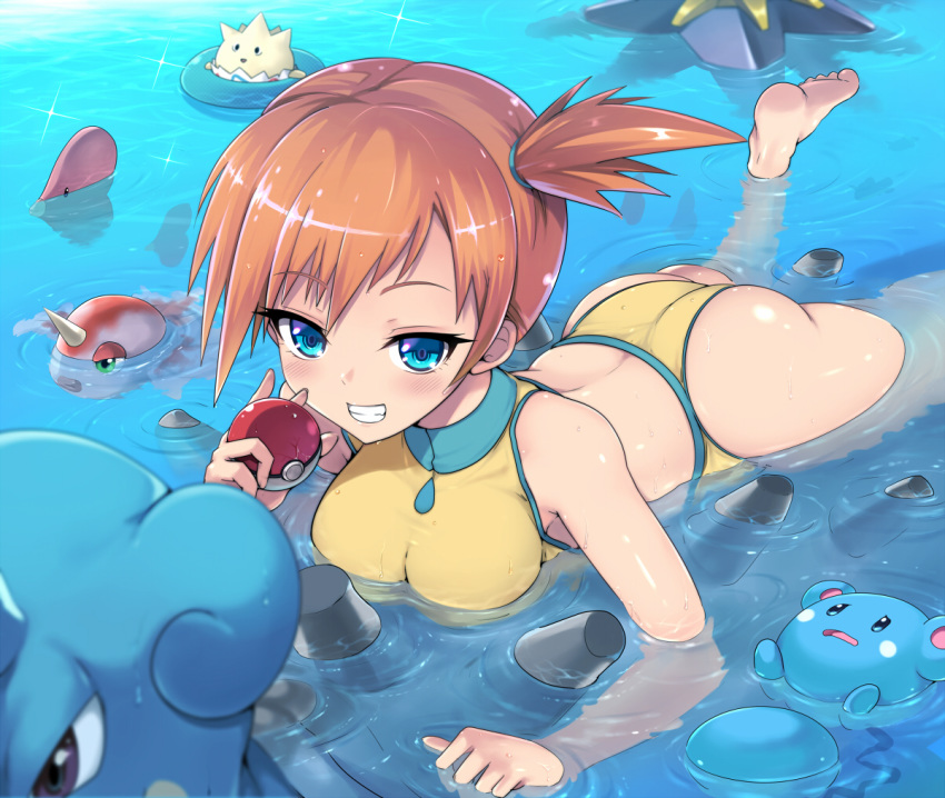 1girl ass bare_arms bare_legs bare_shoulders barefoot blue_eyes blush breasts character_request commentary_request eyebrows_visible_through_hair grin holding kasai_shin kasumi_(pokemon) looking_at_viewer lying on_stomach one-piece_swimsuit open_mouth orange_hair outdoors partially_submerged poke_ball pokemon pokemon_(creature) short_hair side_ponytail smile soles swimsuit water wet