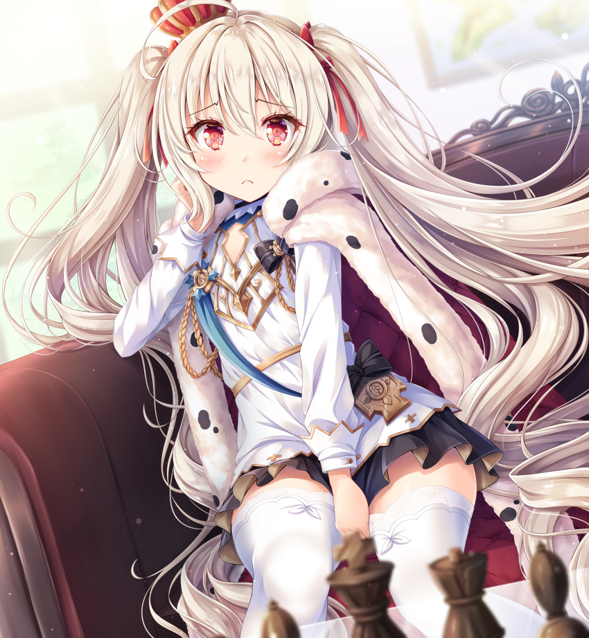 1girl akashio_(loli_ace) azur_lane between_legs black_skirt blurry blurry_background blush cape chess_piece commentary_request couch crown eyebrows_visible_through_hair flat_chest frown fur_cape hair_between_eyes hand_between_legs head_rest highres indoors light_particles long_hair long_sleeves looking_at_viewer pleated_skirt red_eyes shirt sitting skirt solo thigh-highs twintails valiant_(azur_lane) very_long_hair white_hair white_legwear white_shirt