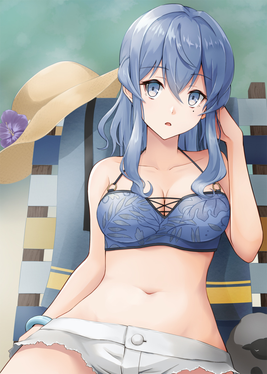 1girl bikini blue_bikini blue_eyes blue_hair breasts chair cowboy_shot cutoffs gotland_(kantai_collection) hat hat_removed headwear_removed highres kantai_collection kodama_(mmt_uf) long_hair looking_at_viewer lounge_chair medium_breasts medium_hair mole mole_under_eye navel short_shorts shorts sitting solo sun_hat swimsuit white_shorts