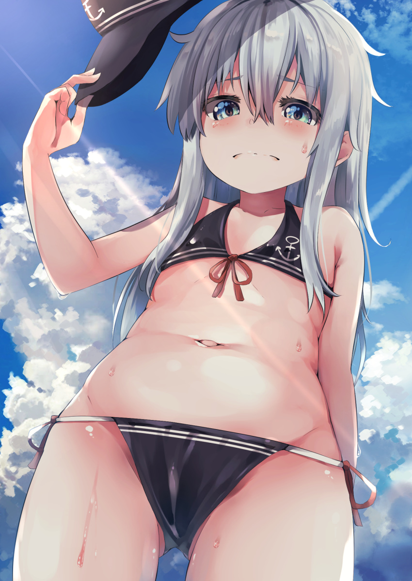 1girl adapted_costume anchor_symbol ass_visible_through_thighs bikini black_bikini black_headwear blue_eyes blue_sky clouds commentary_request cowboy_shot flat_cap from_below hat hat_removed headwear_removed hibiki_(kantai_collection) highres kantai_collection long_hair looking_at_viewer side-tie_bikini silver_hair sky solo swimsuit taisho_(gumiyuki)