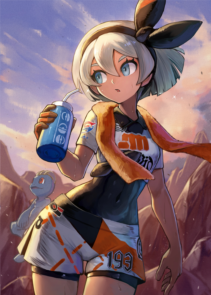 1girl :o bangs bea_(pokemon) black_hairband black_ribbon blue_eyes clothes_writing clouds covered_navel cowboy_shot crop_top day gen_1_pokemon gloves hair_between_eyes hair_ribbon hairband highres holding kuroi_susumu looking_away looking_to_the_side machop orange_gloves outdoors parted_lips pokemon pokemon_(creature) pokemon_(game) pokemon_swsh ribbon rock short_hair short_shorts short_sleeves shorts silver_hair single_glove skin_tight solo towel towel_around_neck white_shorts