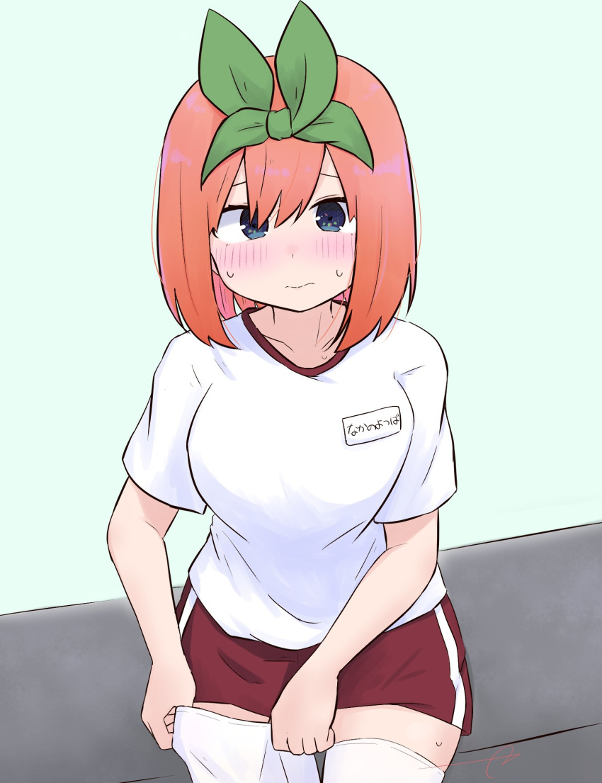 1girl bangs blue_background blue_eyes blush breasts closed_mouth collarbone commentary_request eyebrows_behind_hair go-toubun_no_hanayome green_ribbon gym_shirt gym_shorts gym_uniform hair_between_eyes hair_ribbon highres kujou_karasuma looking_at_viewer medium_breasts nakano_yotsuba name_tag orange_hair red_shorts ribbon shirt short_shorts short_sleeves shorts signature simple_background solo sweat thigh-highs thighhighs_pull wavy_mouth white_legwear white_shirt