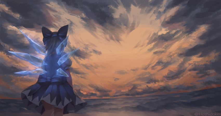 1girl blue_hair bow cirno clouds cloudy_sky dress dress_bow from_behind hair_bow highres hoshitokikei ice ice_wings ocean puffy_short_sleeves puffy_sleeves short_hair short_sleeves sky solo touhou twitter_username wings