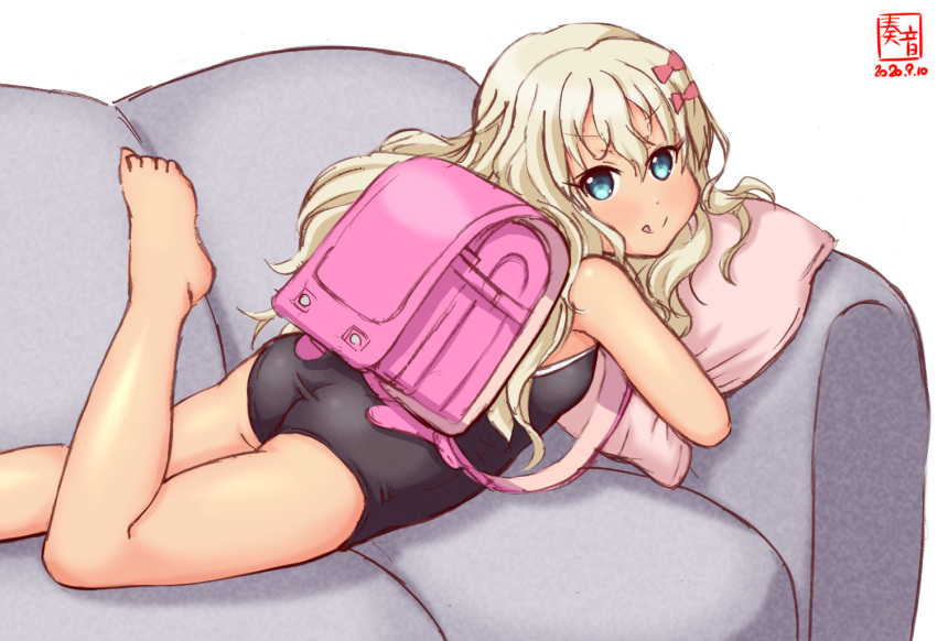 1girl artist_logo ass backpack bag barefoot black_swimsuit blonde_hair blue_eyes bow commentary_request competition_school_swimsuit couch dated grecale_(kantai_collection) hair_ornament hairclip kanon_(kurogane_knights) kantai_collection long_hair looking_at_viewer lying on_stomach pillow pink_bow randoseru school_swimsuit simple_background solo swimsuit tan wavy_hair white_background