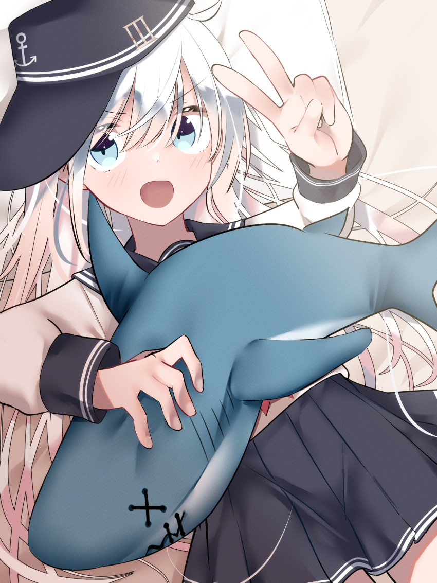 1girl absurdres anchor_symbol black_headwear black_sailor_collar black_skirt blue_eyes blush cowboy_shot eyebrows_visible_through_hair flat_cap hair_between_eyes hat hibiki_(kantai_collection) highres kantai_collection long_hair long_sleeves neckerchief open_mouth pleated_skirt red_neckwear sailor_collar school_uniform serafuku silver_hair skirt solo stuffed_animal stuffed_shark stuffed_toy tetuw v