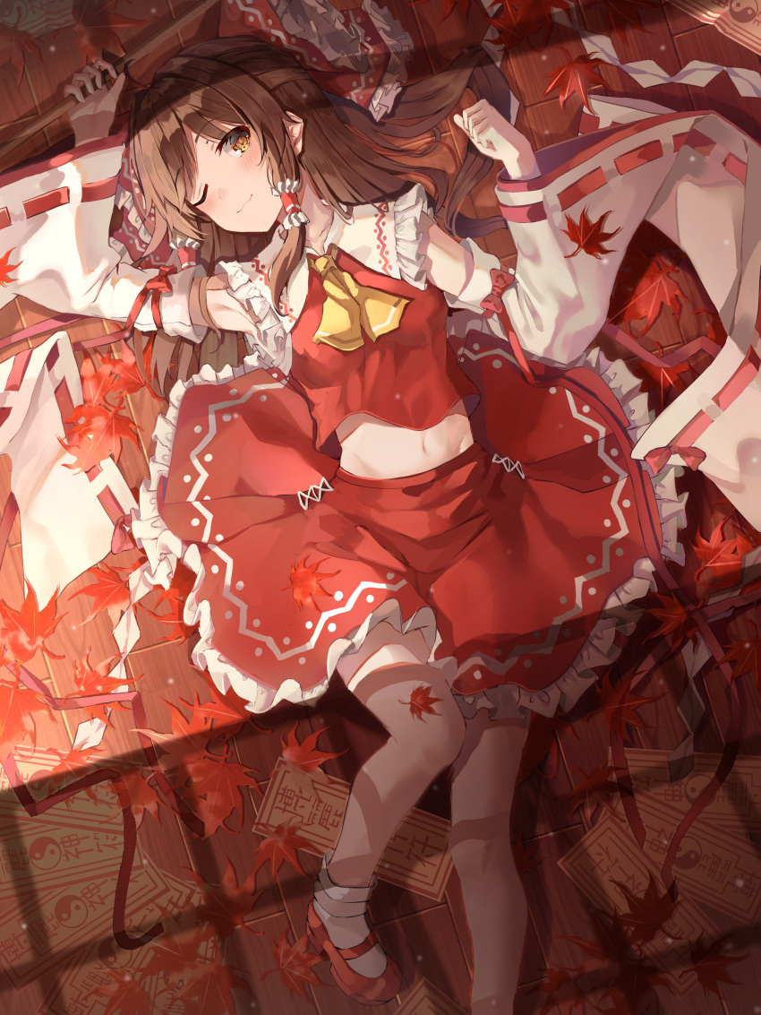 1girl absurdres bow commentary_request detached_sleeves gohei hair_bow hair_tubes hakurei_reimu highres kerno lying midriff navel on_back one_eye_closed red_bow red_skirt skirt smile solo touhou wide_sleeves