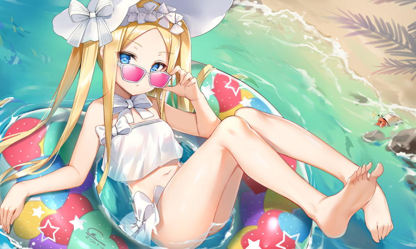 1girl :o abigail_williams_(fate/grand_order) abigail_williams_(swimsuit_foreigner)_(fate) barefoot beach bikini blonde_hair blue_eyes bonnet fate/grand_order fate_(series) frilled_bikini frills ginn_(hzh770121) highres legs long_hair looking_at_viewer navel sand soles solo sunglasses swimsuit water white_bikini