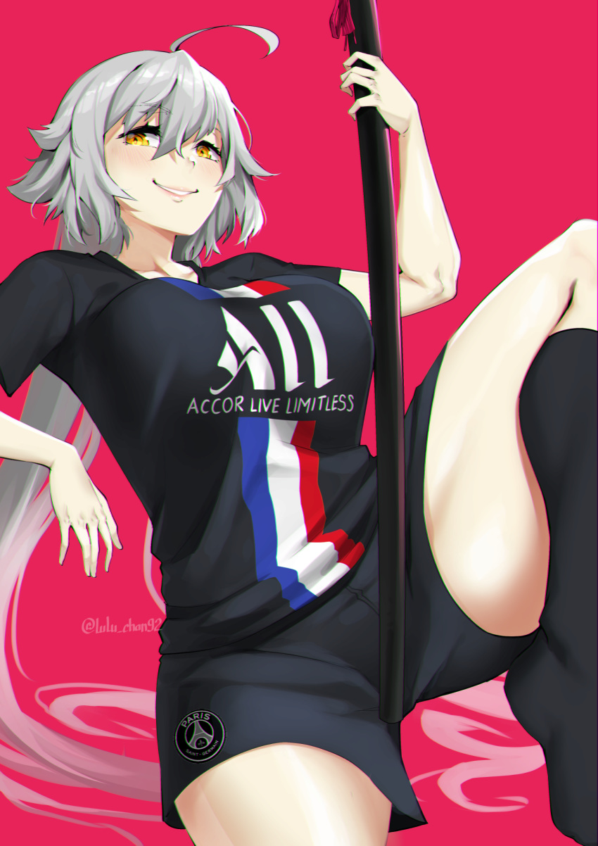 1girl absurdly_long_hair ahoge black_legwear black_shorts blush breasts commentary english_commentary fate/grand_order fate_(series) french_flag highres huge_ahoge jeanne_d'arc_(fate)_(all) katana large_breasts leg_up lips long_hair lulu-chan92 no_shoes paris_saint-germain pink_background print_shirt scabbard sheath sheathed shirt shorts silver_hair smile soccer_uniform socks solo sportswear sword t-shirt thick_thighs thighs twitter_username very_long_hair weapon yellow_eyes
