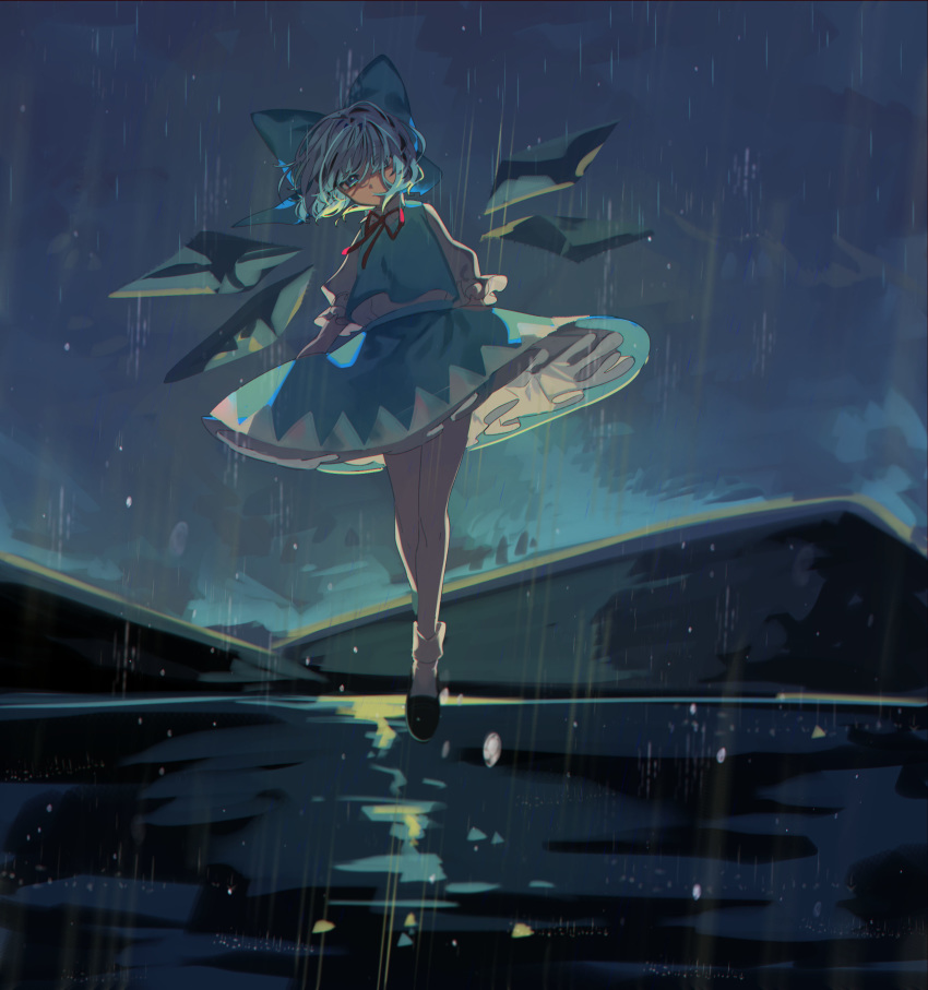 1girl absurdres black_footwear blue_bow blue_eyes blue_hair blue_skirt blue_vest bow cirno clouds cloudy_sky commentary_request detached_wings full_body hair_bow highres hill ice ice_wings lake looking_at_viewer neck_ribbon outdoors rain red_neckwear ribbon shirt shoes short_hair skirt sky socks solo takushiima touhou vest white_legwear white_shirt wings