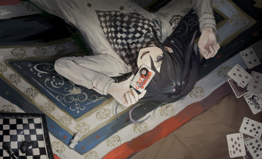 1boy ako_(td110349-7517) bangs black_hair card carpet cassette_tape checkered checkered_scarf chess_piece chessboard dangan_ronpa hair_between_eyes highres holding long_sleeves lying male_focus new_dangan_ronpa_v3 on_back open_mouth ouma_kokichi playing_card scarf solo straitjacket upside-down violet_eyes