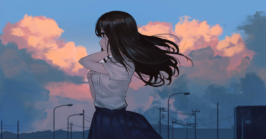 1girl black_hair blue_skirt blue_sky breasts clouds cloudy_sky collared_shirt commentary_request dress_shirt floating_hair hand_on_own_chest hands_up highres lamppost long_hair original outdoors pleated_skirt power_lines ryokucha_manma school_uniform shirt short_sleeves skirt sky small_breasts solo sunset utility_pole white_shirt