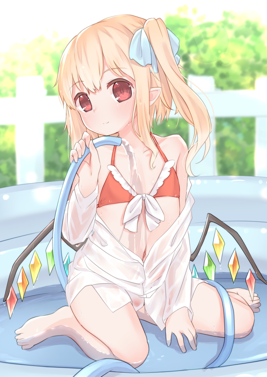 1girl bare_legs bare_shoulders barefoot bikini blonde_hair blue_bow bow closed_mouth day flandre_scarlet flat_chest full_body hair_bow highres hose light_smile long_hair looking_at_viewer navel one_side_up outdoors pointy_ears red_bikini red_eyes sakurea shirt sidelocks sitting solo swimsuit touhou wet wet_clothes wet_shirt white_shirt wings