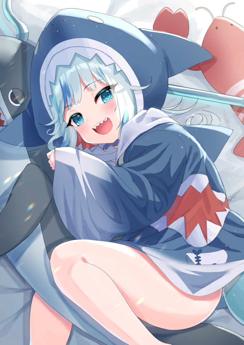 1girl :d animal_hood bangs bed_sheet blue_eyes blue_hair blue_hoodie blush commentary english_commentary eyebrows_visible_through_hair feet_out_of_frame gawr_gura highres hololive hololive_english hood hood_up hoodie long_sleeves looking_at_viewer lying multicolored_hair on_side open_mouth polearm shark_hood sharp_teeth sleeves_past_wrists smile solo streaked_hair stuffed_animal stuffed_shark stuffed_toy teeth trident tsukiman virtual_youtuber weapon wide_sleeves