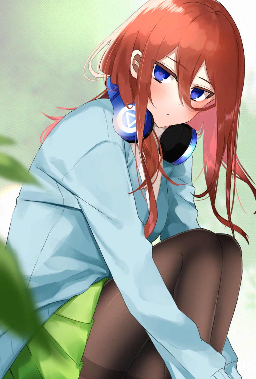 1girl absurdres blue_eyes go-toubun_no_hanayome green_skirt hair_behind_ear headphones highres long_hair looking_at_viewer nakamura_yoru nakano_miku redhead sitting skirt solo