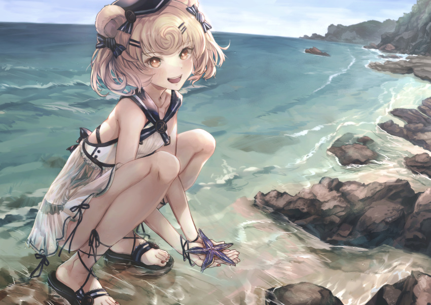 1girl :d absurdres animal_ears arknights bangs bare_shoulders bear_ears black_headwear blonde_hair blue_sky brown_eyes commentary_request day dress eyebrows_visible_through_hair gummy_(arknights) hakua_mill highres holding huge_filesize looking_at_viewer ocean open_mouth partial_commentary sandals short_hair sky sleeveless sleeveless_dress smile solo squatting starfish toenail_polish water white_dress