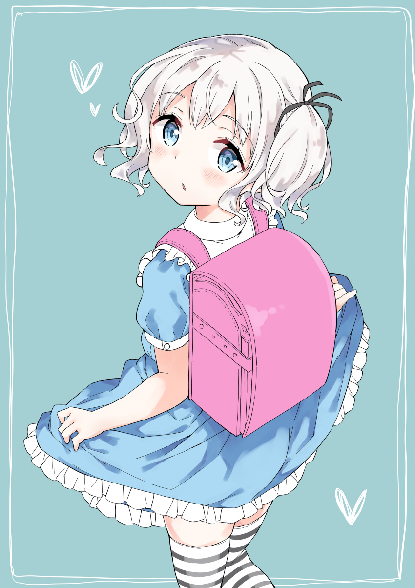 1girl absurdres backpack bag bangs black_ribbon blue_background blue_dress blue_eyes commentary_request dress eyebrows_visible_through_hair frilled_dress frills from_behind gyuunyuu_nomio hair_ribbon heart highres joshi_shougakusei_hajimemashita looking_at_viewer looking_back nono_(joshi_shougakusei_hajimemashita) parted_lips puffy_short_sleeves puffy_sleeves randoseru ribbon short_sleeves silver_hair skirt_hold solo standing striped striped_legwear thigh-highs twintails