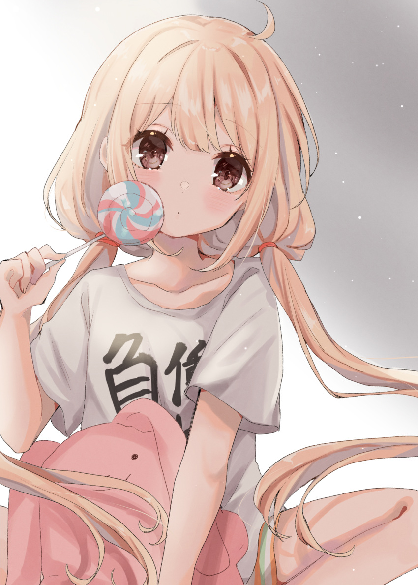 1girl blonde_hair brown_eyes brown_hair candy clothes_writing commentary_request food futaba_anzu highres holding holding_candy holding_food holding_stuffed_toy idolmaster idolmaster_cinderella_girls long_hair looking_at_viewer low_twintails rino_cnc shirt short_sleeves solo stuffed_animal stuffed_bunny stuffed_toy t-shirt twintails you_work_you_lose
