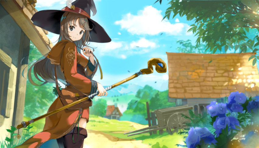 1girl black_eyes blurry blurry_background boots brown_hair cart commentary day depth_of_field fantasy flower grass hat holding hood hood_down long_hair looking_at_viewer looking_back original outdoors pouch robe scenery sky solo staff thigh-highs thigh_boots tree witch witch_hat yoshitake zettai_ryouiki