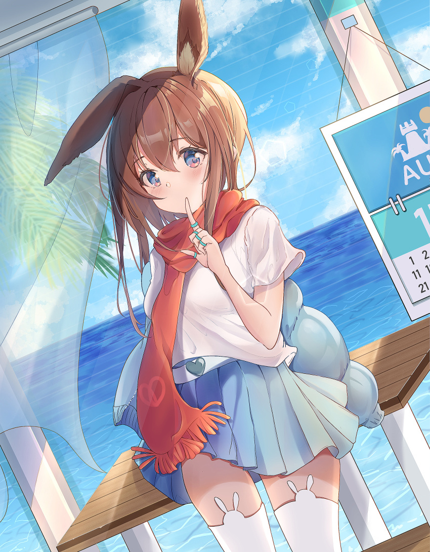 1girl absurdres amiya_(arknights) animal_ears arknights arm_up belt blue_eyes blue_skirt breasts brown_hair calendar_(object) cowboy_shot curtains dutch_angle finger_to_mouth hair_between_eyes highres jewelry leaning_on_object long_hair looking_at_viewer medium_breasts nayuuchan palm_tree pleated_skirt rabbit_ears red_scarf ring scarf shirt short_sleeves skirt solo table thigh-highs tree water white_legwear white_shirt window