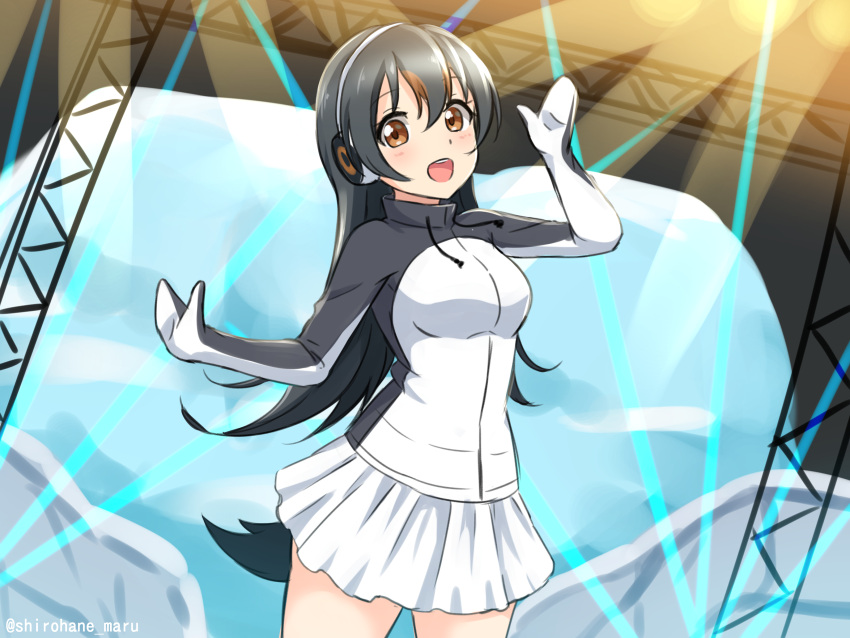 1girl :d absurdres bangs black_hair breasts brown_eyes cowboy_shot drawstring gentoo_penguin_(kemono_friends) hair_between_eyes headphones highres jacket kemono_friends large_breasts long_hair looking_at_viewer open_mouth penguin_tail shiraha_maru skirt smile solo stage stage_lights tail twitter_username white_skirt