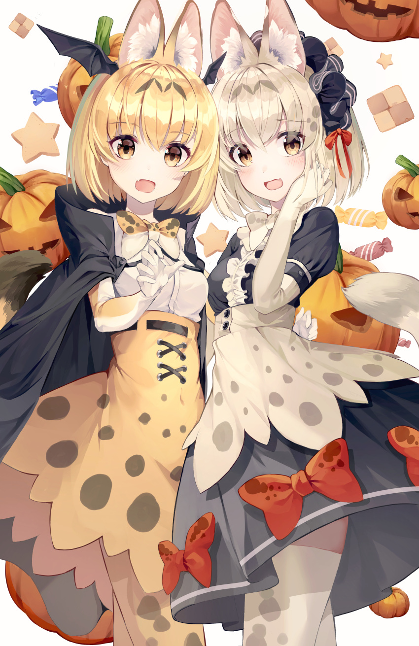 2girls :d absurdres adapted_costume animal_ear_fluff animal_ears animal_ears_(artist) bat_wings black_cape blonde_hair bow bowtie candy cape center_frills checkerboard_cookie commentary cookie elbow_gloves extra_ears eyebrows_visible_through_hair fang food frills gloves halloween head_wings headdress highres jack-o'-lantern kemono_friends looking_at_viewer multiple_girls open_mouth print_bow print_legwear print_neckwear print_skirt puffy_short_sleeves puffy_sleeves red_bow serval_(kemono_friends) serval_ears serval_print shirt short_hair short_sleeves simple_background skin_fang skirt smile tail thigh-highs white_background white_serval_(kemono_friends) white_shirt wings yellow_eyes