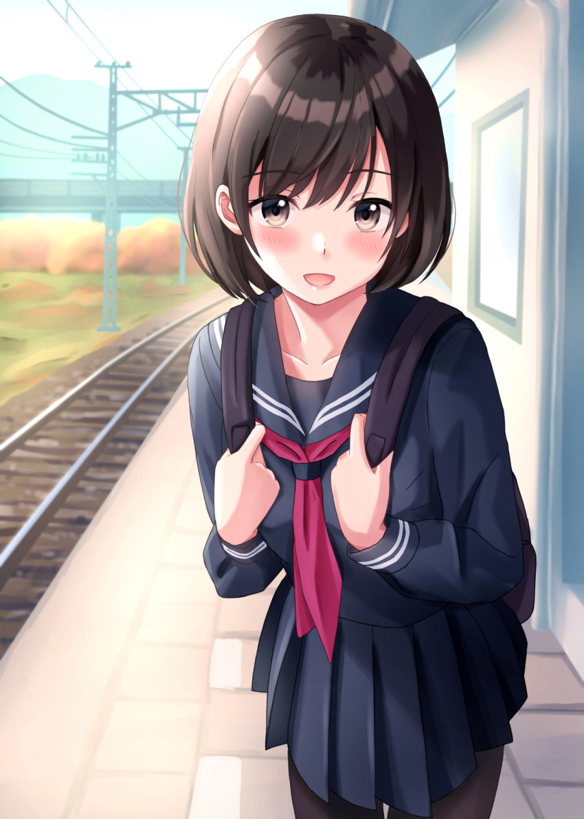 1girl :d backpack bag bangs black_legwear blue_skirt blush brown_eyes brown_hair commentary_request eyebrows_visible_through_hair highres looking_at_viewer open_mouth original outdoors pantyhose pleated_skirt railroad_tracks red_neckwear school_uniform serafuku short_hair skirt smile standing yukimaru217