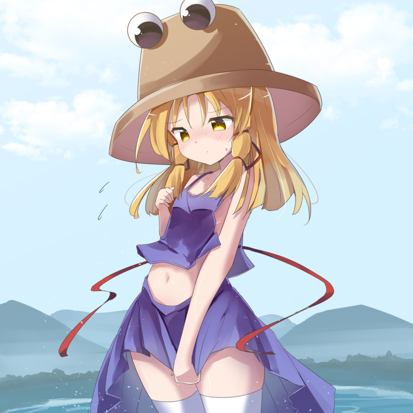 1girl bangs blonde_hair blue_sky blush brown_headwear camisole closed_mouth clouds commentary_request day eyebrows_visible_through_hair flying_sweatdrops hair_between_eyes hair_ribbon hand_up hat highres long_hair moriya_suwako mountain nose_blush outdoors pleated_skirt purple_camisole purple_skirt red_ribbon ribbon ryogo skirt sky solo sweat thigh-highs touhou water white_legwear yellow_eyes