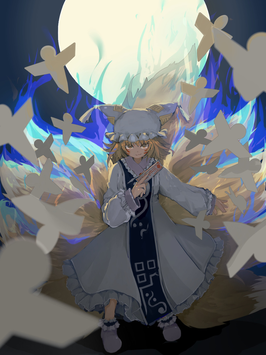 1girl :3 absurdres animal_ears arm_at_side between_fingers blonde_hair blue_fire closed_mouth commentary dress fire fox_ears fox_tail frilled_dress frilled_legwear frilled_sleeves frills full_moon hand_up hat highres kitsune kurui96 light_brown_hair long_dress long_sleeves looking_at_viewer moon multiple_tails ofuda origami outstretched_arm pillow_hat short_hair sleeve_cuffs smirk smug solo tabard tail tassel touhou whisker_markings white_dress white_footwear yakumo_ran yellow_eyes younger