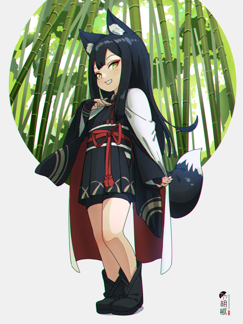 1girl animal_ear_fluff animal_ears bamboo bamboo_forest bike_shorts black_footwear black_hair black_hakama black_kimono black_shorts boots bridal_gauntlets commentary_request forest fox_ears fox_girl fox_tail full_body green_eyes grey_background grin hakama hakama_skirt hand_up highres japanese_clothes kimono kuro_kosyou long_hair long_sleeves looking_at_viewer nature original shadow short_shorts shorts smile solo standing tail very_long_hair wide_sleeves
