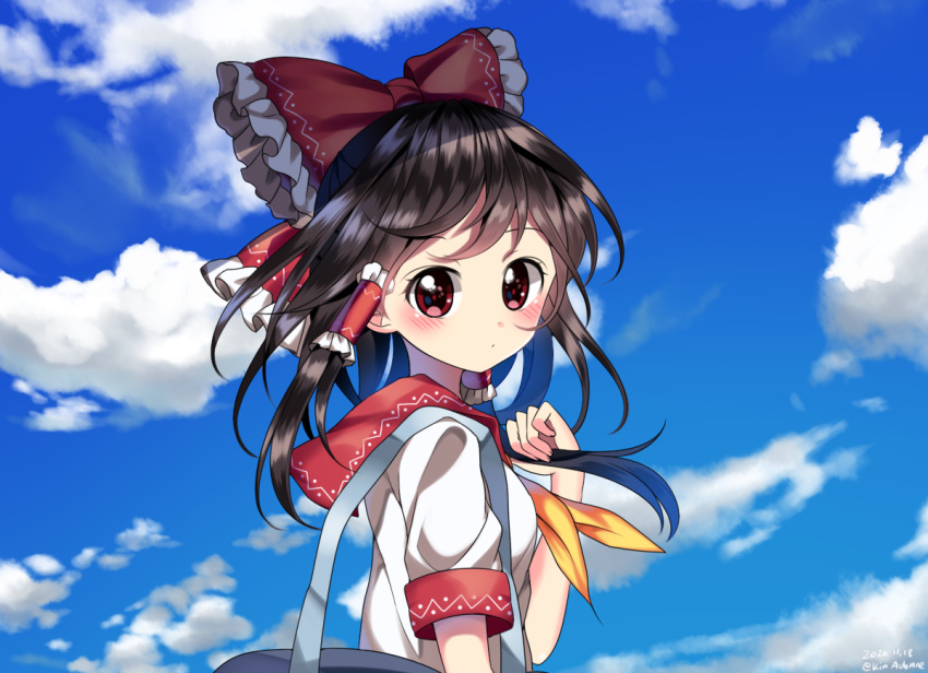 artist_name bag blush bow brown_hair clouds commentary dated hair_bow hair_tubes hakurei_reimu hand_up kimautomne long_hair looking_at_viewer neckerchief red_bow red_eyes sailor_collar shirt short_sleeves shoulder_bag touhou upper_body white_shirt yellow_neckwear