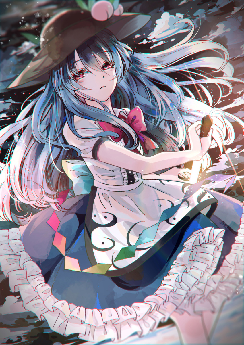 1girl black_headwear blue_hair blue_skirt blurry bow bowtie closed_mouth clouds commentary_request dark_background dutch_angle dx7537 feet_out_of_frame floating_hair food frilled_skirt frills fruit glowing glowing_sword glowing_weapon hair_between_eyes hat highres hinanawi_tenshi light_particles long_hair peach puffy_short_sleeves puffy_sleeves rainbow_order red_bow red_eyes sheath shirt short_sleeves skirt sky solo standing sword sword_of_hisou touhou unsheathing weapon white_shirt