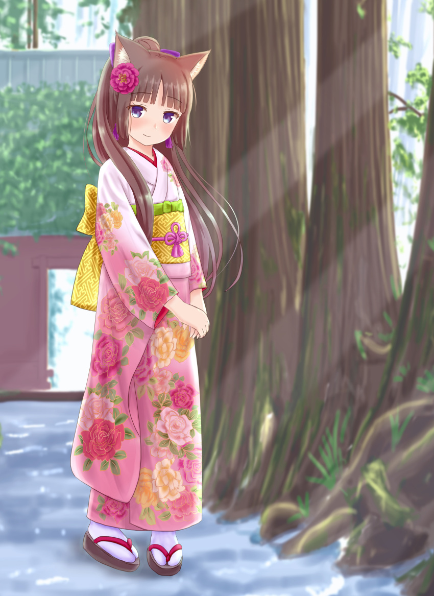 1girl absurdres animal_ear_fluff animal_ears bangs blurry blurry_background blush brown_footwear brown_hair cat_ears closed_mouth commentary_request depth_of_field eyebrows_visible_through_hair floral_print flower full_body hair_flower hair_ornament hands_together highres iroha_(iroha_matsurika) japanese_clothes kimono long_hair long_sleeves miko obi original own_hands_together pink_kimono print_kimono purple_flower sash smile socks solo standing tabi tree very_long_hair violet_eyes white_legwear wide_sleeves zouri