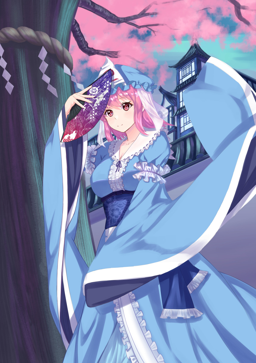 1girl absurdres architecture bangs black_ribbon blue_headwear blue_kimono blue_sash breasts cherry_blossoms closed_mouth collarbone commentary_request east_asian_architecture fan from_below hat highres holding holding_fan japanese_clothes kimono lan_qiandai long_sleeves medium_breasts mob_cap pink_eyes pink_hair ribbon saigyouji_yuyuko saigyouji_yuyuko's_fan_design sash short_hair sky sleeves_past_wrists smile solo standing swept_bangs touhou tree triangular_headpiece wall wide_sleeves