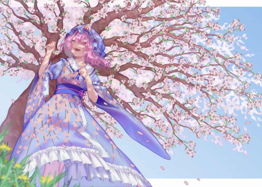 1girl :d blue_kimono blurry breasts cherry_blossoms dandelion day depth_of_field feet_out_of_frame floral_print flower from_below grass hat japanese_clothes kimono looking_ahead medium_breasts medium_hair mob_cap open_mouth outdoors pink_eyes pink_hair saigyouji_yuyuko smile solo teruteru_(teru_teru) touhou tree wide_sleeves yellow_flower