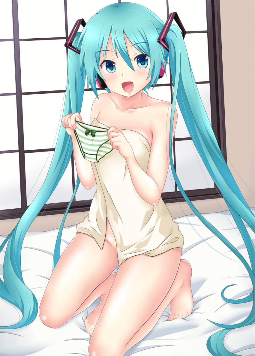 1girl :d bangs barefoot bed_sheet blue_eyes blue_hair bow bow_panties breasts collarbone eyebrows_visible_through_hair green_bow hair_between_eyes hair_ornament hatsune_miku headphones highres holding holding_clothes holding_panties holding_underwear indoors kneeling long_hair looking_at_viewer naked_towel nendoroya open_mouth panties shiny shiny_hair small_breasts smile solo striped striped_panties towel twintails underwear very_long_hair vocaloid white_towel