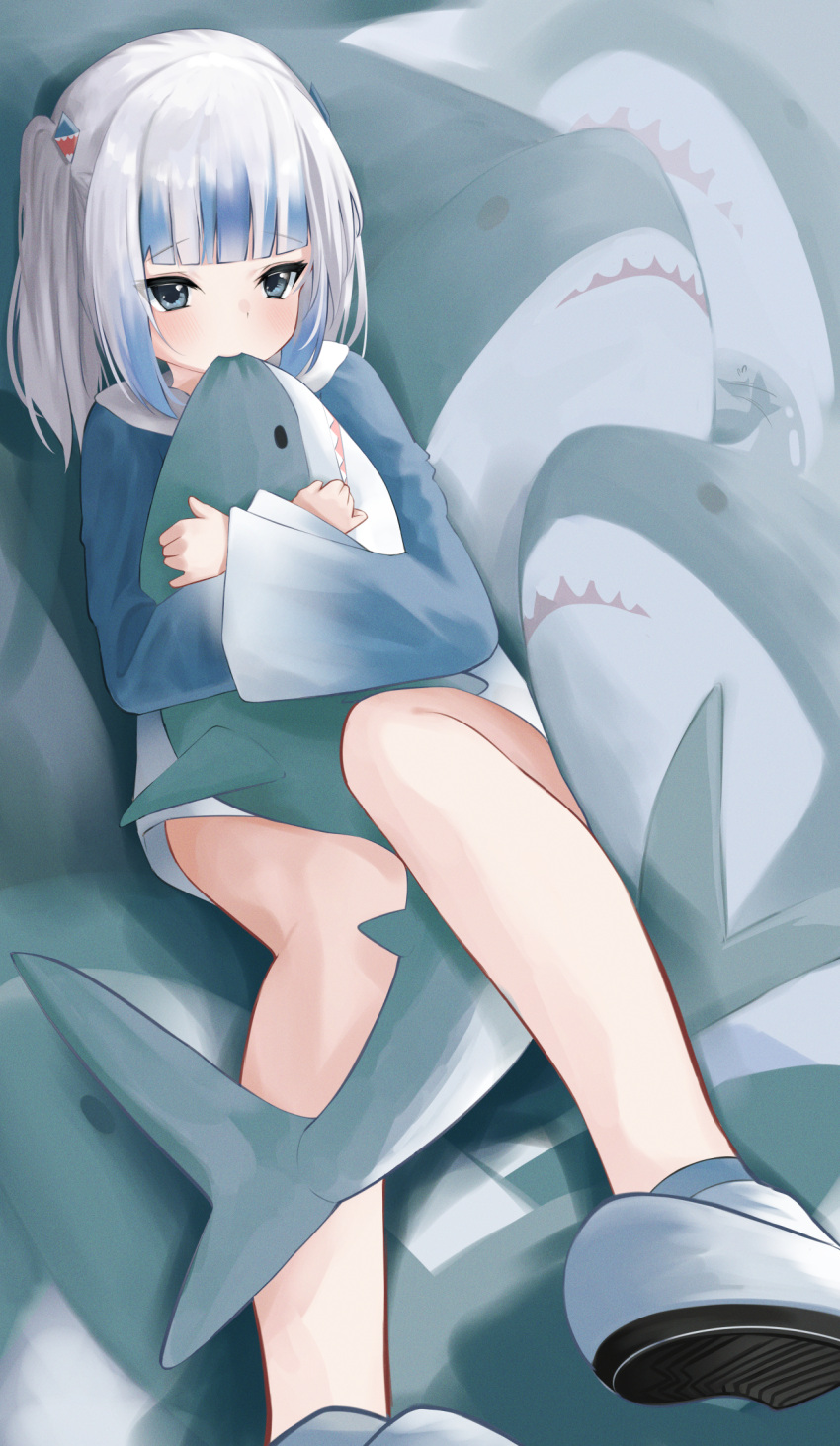 1girl animal animal_hug biting_shark bloop_(gawr_gura) blue_eyes blue_hoodie fish_tail flailing gawr_gura grey_hair hair_ornament highres hololive hololive_english hood hood_down hoodie ikea_shark knees_up legs_up looking_at_viewer multicolored_hair shark shark_hair_ornament shark_tail shoes sidelocks solo streaked_hair stuffed_animal stuffed_shark stuffed_toy tail tsurime two_side_up virtual_youtuber yuzuno_kaori