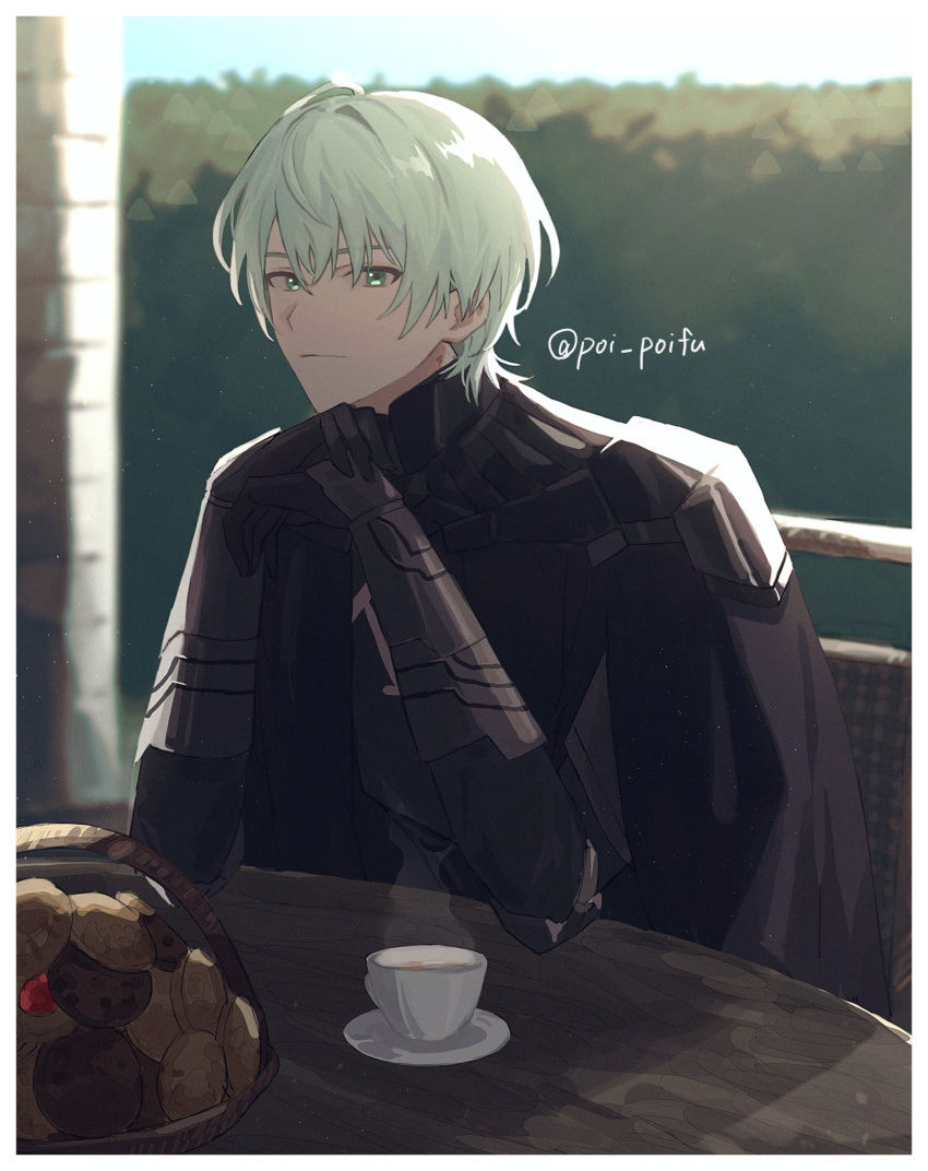 1boy armor bangs black_gloves byleth_(fire_emblem) byleth_eisner_(male) cape closed_mouth cookie cup elbow_rest fire_emblem food gloves green_eyes green_hair highres looking_at_viewer male_focus outdoors poi_poifu solo steam table twitter_username