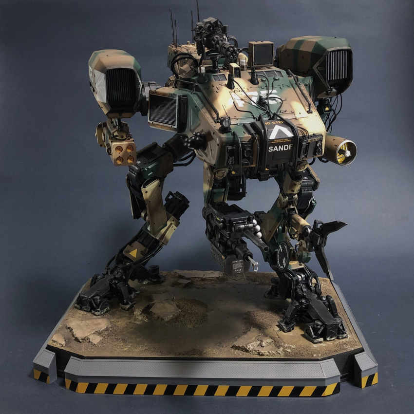 camouflage chappie gatling_gun highres kusami_toka_naku_au mecha military model_kit moose_(chappie) no_humans photo_(medium) rocket_launcher science_fiction solo standing turret weapon