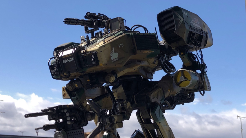 camouflage chappie clouds from_side gatling_gun highres looking_ahead mecha model_kit moose_(chappie) no_humans photo_(medium) science_fiction sky solo turret