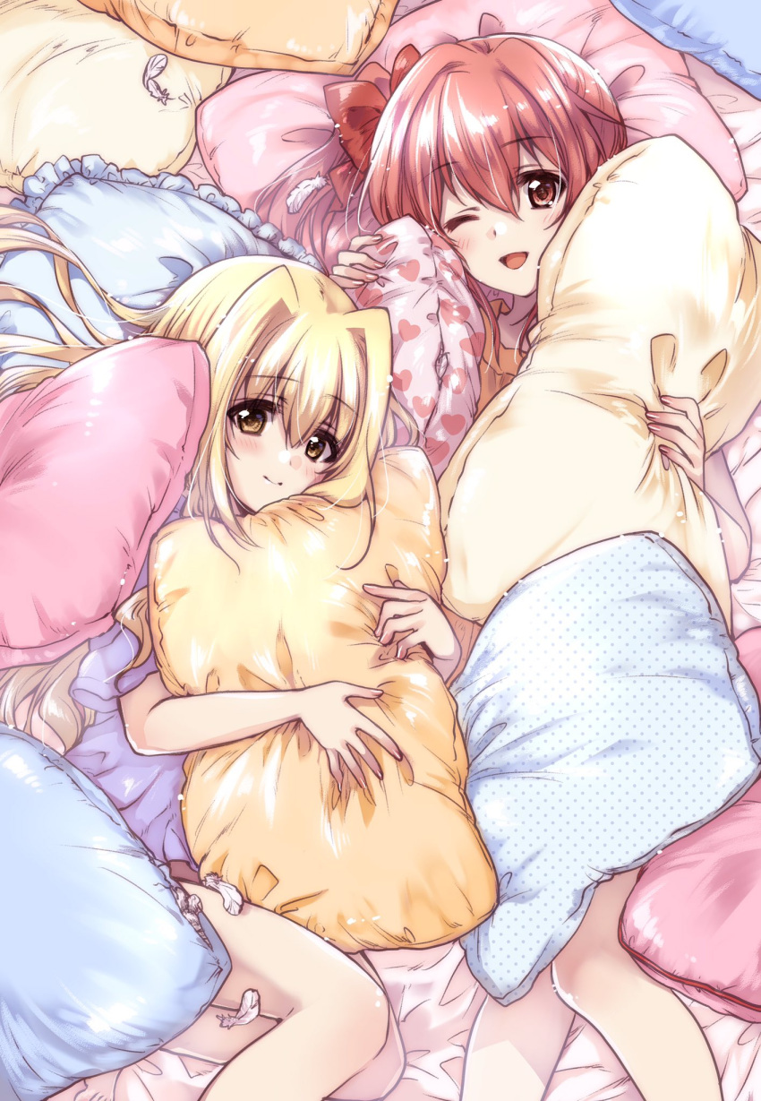 2girls bangs bed_sheet blonde_hair blue_shirt bow brown_eyes closed_mouth commentary_request eyebrows_visible_through_hair feathers from_above hair_bow hair_intakes highres holding holding_pillow iris_(nanoha) kuroi_mimei long_hair looking_at_viewer lying lyrical_nanoha mahou_shoujo_lyrical_nanoha_detonation multiple_girls on_back on_bed one_eye_closed open_mouth pajamas pillow red_eyes redhead shirt short_sleeves smile yuri_eberwein